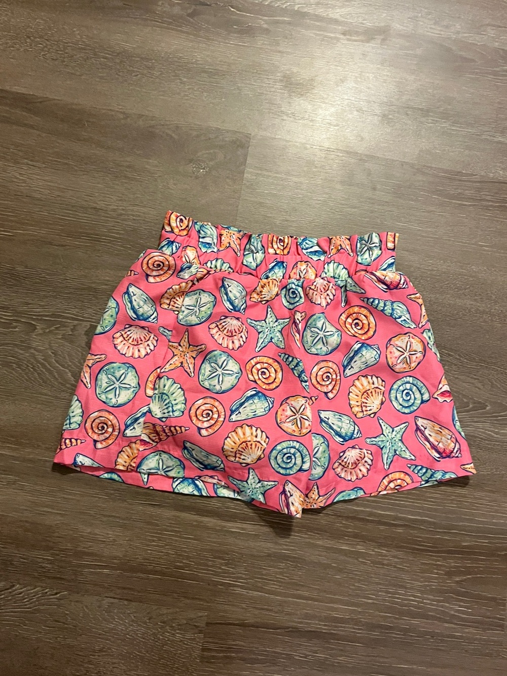 Simply Sea Shorts with seashells and starfish in pink, blue, and orange size sma